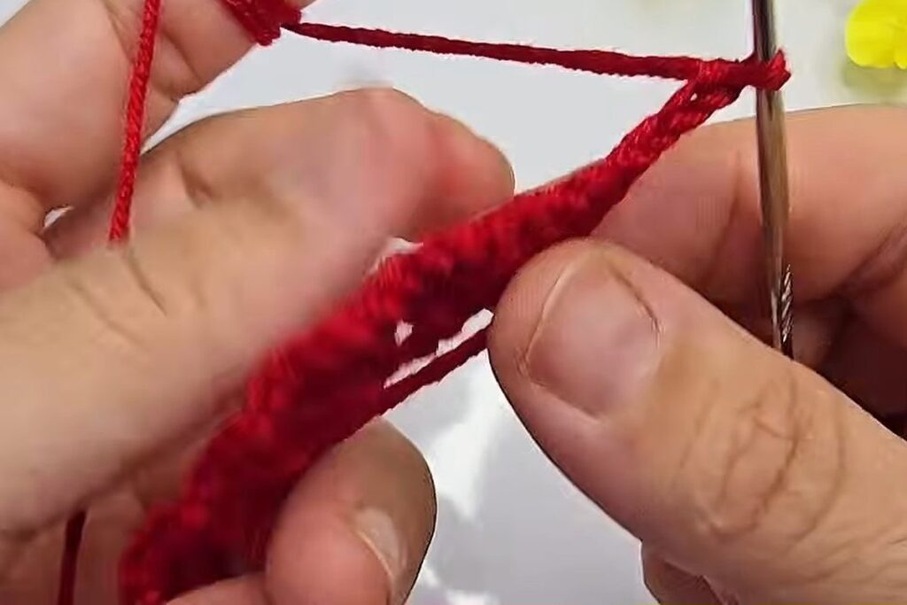 Chain 3 at the start of the petal row on a crochet flower with stem strip