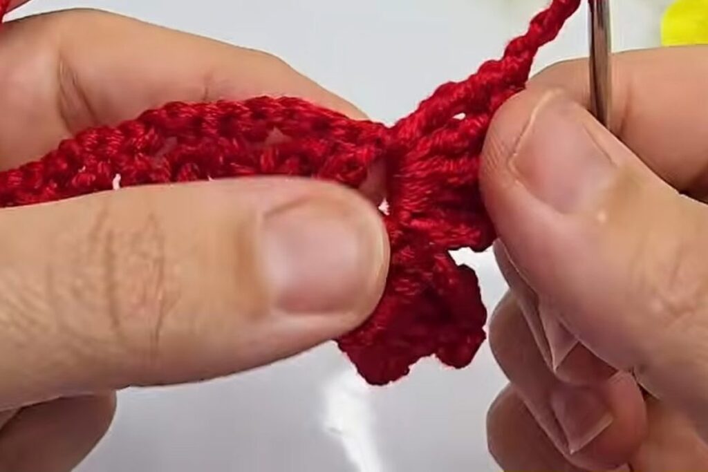 Petals worked along the mesh strip for a crochet flower with stem
