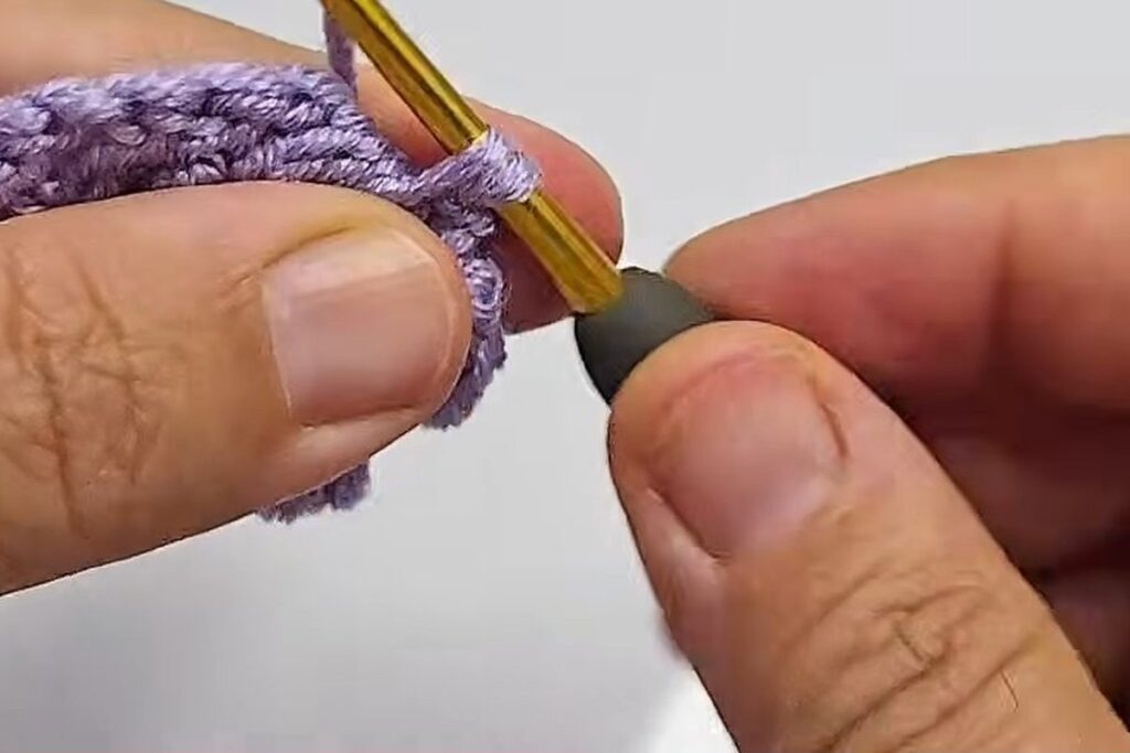 Chain 3 and single crochet moving the yarn to the next space of the strip