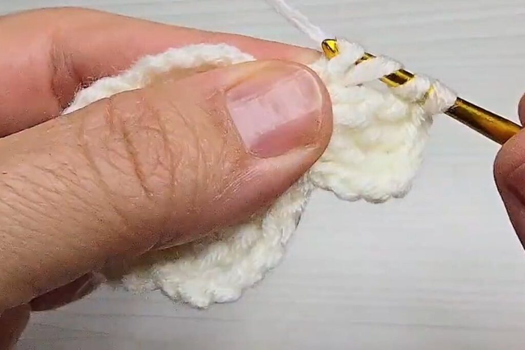 Working treble crochet into a chain loop for a layered crochet flower petal