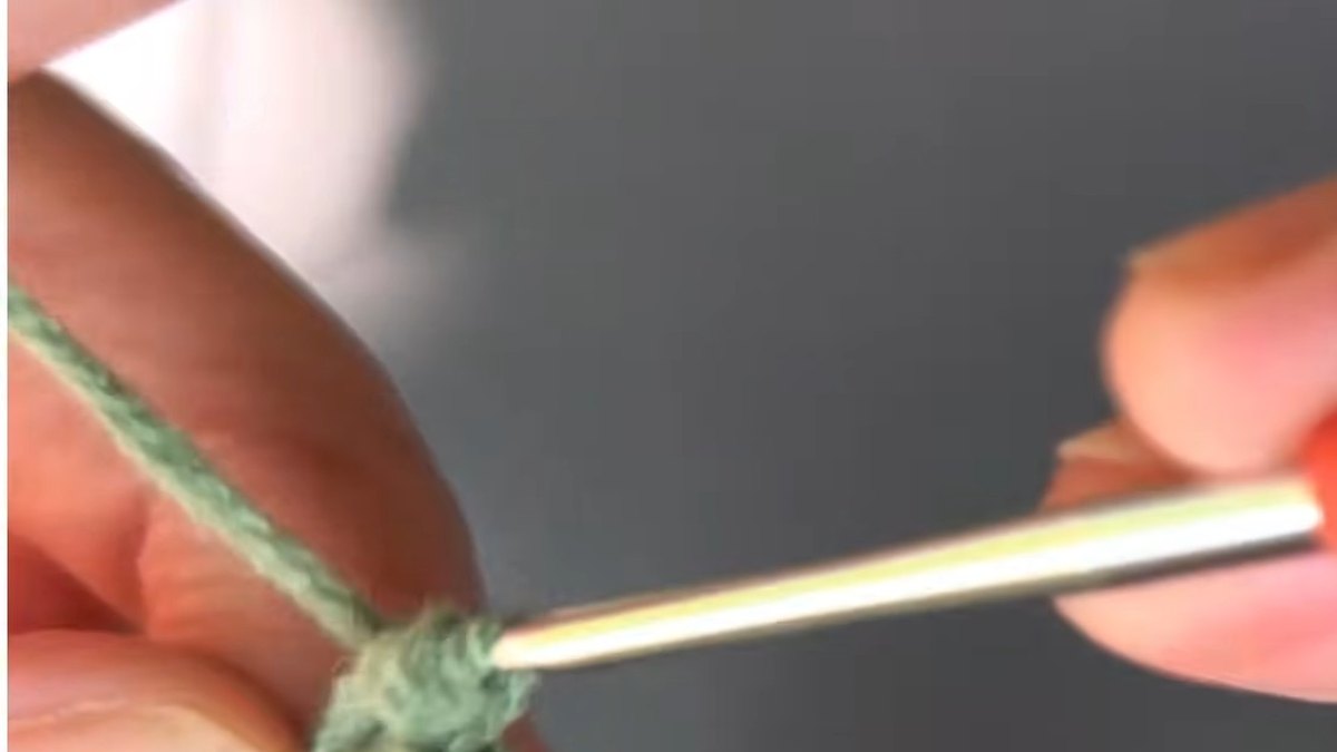 Three single crochet turning the tip of a green crochet lily flower leaf