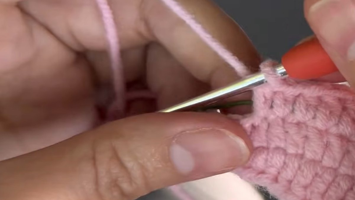 Round 3 of a crochet lily flower petal almost finished with 5 dc, 3 hdc and 4 sc