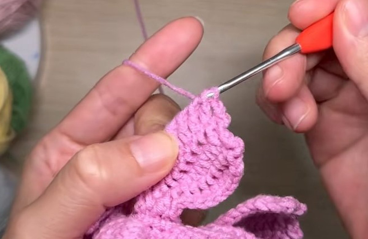 Tall Afghan stitch rows of a fourth-layer petal standing out from the crochet peony flower