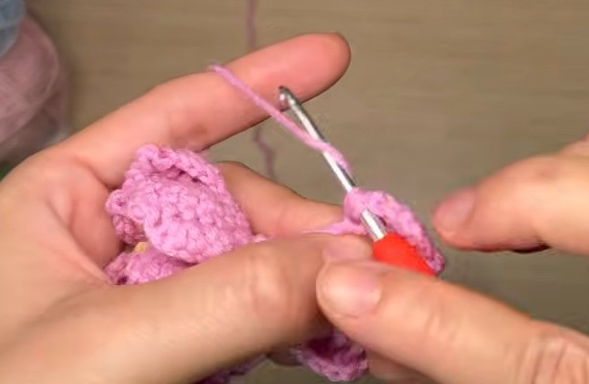 Last row of a second-layer petal being worked in ordinary stitches for the crochet peony flower