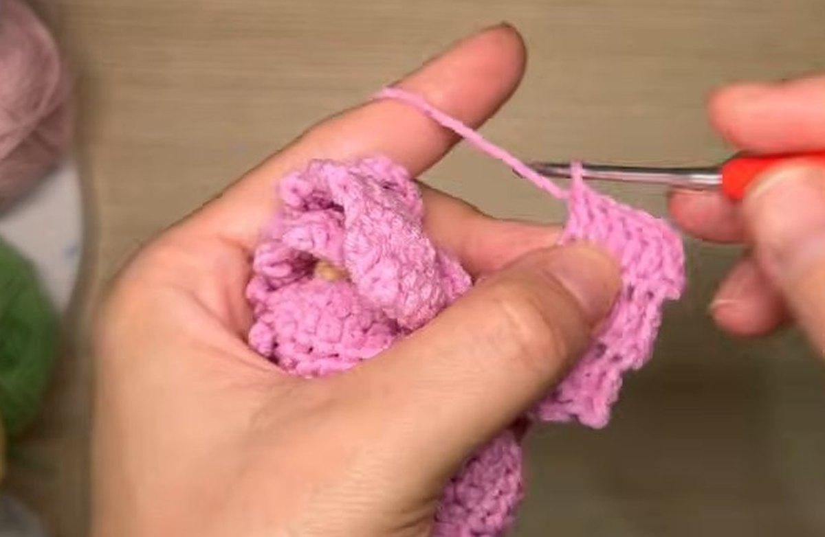 Last ordinary-stitch row of a third-layer petal being worked on the crochet peony flower